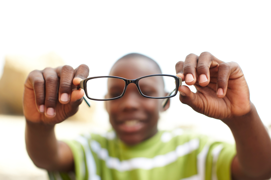Boy showing his glasses